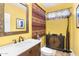 This quirky powder room features yellow walls, and a stylish vanity with a vessel sink at 31156 N 137Th Ln, Peoria, AZ 85383