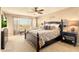 Spacious bedroom with a large window offering neighborhood views at 31156 N 137Th Ln, Peoria, AZ 85383
