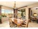 Bright dining room with sliding glass doors that lead to a covered patio at 31156 N 137Th Ln, Peoria, AZ 85383