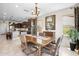 Cozy dining area features a wooden table, chandelier, and access to the kitchen at 31156 N 137Th Ln, Peoria, AZ 85383