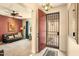 Warm entryway featuring a security door and a glimpse into the living room at 31156 N 137Th Ln, Peoria, AZ 85383