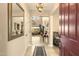 Inviting entryway with a chandelier, mirror, and a view into the living room at 31156 N 137Th Ln, Peoria, AZ 85383