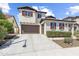 Two-story home with a three-car garage, neutral siding, and mature landscaping at 31156 N 137Th Ln, Peoria, AZ 85383