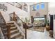 Grand foyer showcasing a staircase, high ceilings, and an open floor plan to the living room at 31156 N 137Th Ln, Peoria, AZ 85383