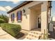 Home's welcoming front entrance with desert landscaping, steps, and dark trim at 31156 N 137Th Ln, Peoria, AZ 85383