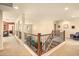 Upstairs landing area featuring a view of the living room and stairs at 31156 N 137Th Ln, Peoria, AZ 85383