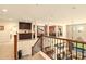 Open landing overlooking the lower level with views of multiple living spaces at 31156 N 137Th Ln, Peoria, AZ 85383