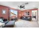 Comfortable living room with a sofa, a window view of the neighborhood, and an adjacent hallway at 31156 N 137Th Ln, Peoria, AZ 85383