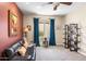 Inviting living room features neutral walls, a brown leather sofa, blue curtains, and stylish decor at 31156 N 137Th Ln, Peoria, AZ 85383