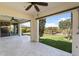Spacious covered patio features tile flooring and views of the landscaped backyard and desert beyond at 31156 N 137Th Ln, Peoria, AZ 85383