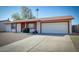 Charming single-level home featuring a two-car garage, low maintenance landscaping, and neutral color scheme at 3209 W Charleston Ave, Phoenix, AZ 85053