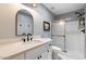Updated bathroom features modern vanity with white countertop and glass-enclosed shower at 3345 E University Dr # 72, Mesa, AZ 85213