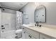 Bathroom with modern vanity, white counter, black hardware, and a shower-tub combo at 3345 E University Dr # 72, Mesa, AZ 85213