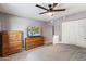 Comfortable bedroom with carpet, light purple walls, ceiling fan and closet at 3345 E University Dr # 72, Mesa, AZ 85213