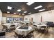 Large event space with tables, chairs, and neutral decor, perfect for gatherings and celebrations at 3345 E University Dr # 72, Mesa, AZ 85213