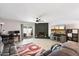 Inviting living room features a cozy brick fireplace and sliding glass doors to the backyard patio at 3345 E University Dr # 72, Mesa, AZ 85213
