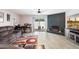 Comfortable living room with ceiling fan, decorative fireplace, and sliding glass doors to the outdoor patio at 3345 E University Dr # 72, Mesa, AZ 85213
