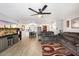 This wide open living room connects to dining area and has sleek wood-look tile flooring at 3345 E University Dr # 72, Mesa, AZ 85213