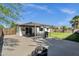 Wide backyard featuring a patio, grill, fire pit, and outdoor seating, all within a fenced-in yard at 3711 S Judd St, Tempe, AZ 85282
