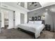 Stylish main bedroom featuring a mirrored ceiling, modern lighting, and a comfortable bed at 3711 S Judd St, Tempe, AZ 85282