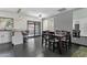 Open dining area with a modern table, direct access to the kitchen and bright view to the outdoors at 3711 S Judd St, Tempe, AZ 85282