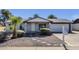 Charming single-story home features brick accents, a well-manicured yard, and a two-car garage at 3711 S Judd St, Tempe, AZ 85282