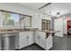 Bright kitchen features granite countertops, stainless steel appliances, and custom lighting at 3711 S Judd St, Tempe, AZ 85282