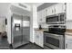 Modern kitchen is equipped with stainless steel appliances and ample counter space at 3711 S Judd St, Tempe, AZ 85282