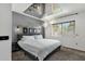 Serene main bedroom featuring a mirrored ceiling, modern lighting, and a comfortable bed at 3711 S Judd St, Tempe, AZ 85282