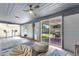 Spacious recreation room featuring tile floors, beamed ceilings, and a sliding glass door to the backyard patio at 3711 S Judd St, Tempe, AZ 85282
