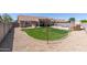 Large backyard features a patch of grass and potential for outdoor activities at 3784 E Simpson Ct, Gilbert, AZ 85297