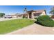 Well-manicured front lawn of this home with mature landscaping and an arched entryway at 3784 E Simpson Ct, Gilbert, AZ 85297