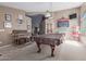 Spacious game room featuring a pool table and large windows offering natural light at 3784 E Simpson Ct, Gilbert, AZ 85297