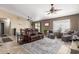 Open-concept living area featuring tile floors, ceiling fans and comfortable seating at 3784 E Simpson Ct, Gilbert, AZ 85297
