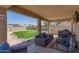 Relaxing covered outdoor patio with comfortable seating and barbecue area, perfect for entertaining and enjoying outdoor living at 3784 E Simpson Ct, Gilbert, AZ 85297