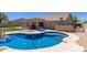 Backyard pool with covered patio, perfect for relaxation and entertaining, complete with lounge chairs at 3784 E Simpson Ct, Gilbert, AZ 85297