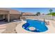 Beautiful backyard pool with a built-in table and chairs, and a basketball hoop at 3784 E Simpson Ct, Gilbert, AZ 85297