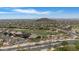Expansive aerial view showcasing the community, lush greenery, and distant mountain views at 3812 N Barron --, Mesa, AZ 85207