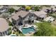 Aerial view of a backyard featuring a private pool, spa, patio, and desert landscaping at 3812 N Barron --, Mesa, AZ 85207