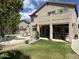 Spacious backyard featuring a pool, covered patio, and well-maintained lawn at 3812 N Barron --, Mesa, AZ 85207