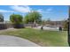 Large, landscaped backyard with a pool, patio area, and privacy fence at 3812 N Barron --, Mesa, AZ 85207