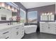Luxurious bathroom with dual vanities, a soaking tub, and modern fixtures, creating a serene retreat at 3812 N Barron --, Mesa, AZ 85207
