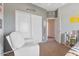 This bedroom includes carpet, a chair, closet and open doorway to another room at 3812 N Barron --, Mesa, AZ 85207