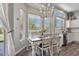 Bright dining area with a chandelier, large windows, and views of the backyard at 3812 N Barron --, Mesa, AZ 85207