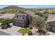 Front exterior of two-story home with three-car garage, desert landscaping, and neutral stucco at 3812 N Barron --, Mesa, AZ 85207