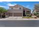 Front exterior of a home with a three-car garage, well-maintained lawn, and manicured bushes at 3812 N Barron --, Mesa, AZ 85207