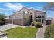 Front exterior of a home with a three-car garage, well-maintained lawn, and manicured bushes at 3812 N Barron --, Mesa, AZ 85207