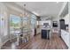 Open-concept kitchen with an adjacent dining area featuring large windows and natural light at 3812 N Barron --, Mesa, AZ 85207