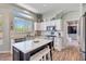 Well-lit kitchen featuring stainless steel appliances, an island, and white cabinetry at 3812 N Barron --, Mesa, AZ 85207
