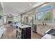 Open kitchen featuring a center island, stainless steel appliances, and natural light at 3812 N Barron --, Mesa, AZ 85207